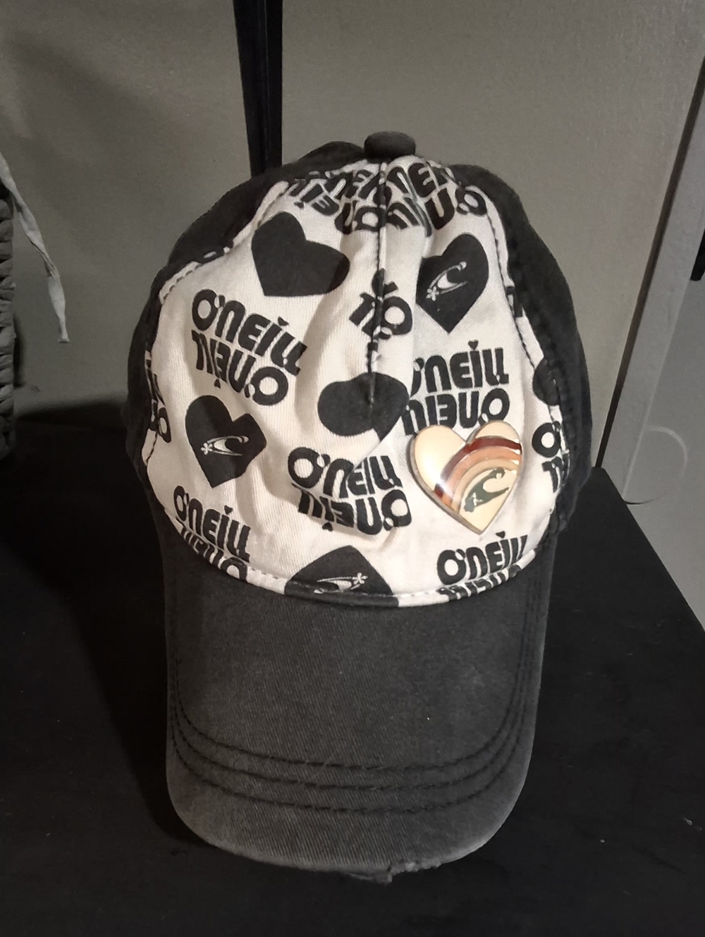 O'Neill Black and White Heart-Print Baseball Cap with Rainbow Pin